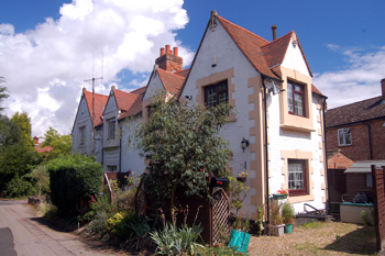 Cottages at the junction of Woburn Lane and Spinney Lane July 2010